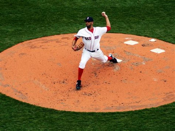 Can a fielder stand in front of the pitcher?