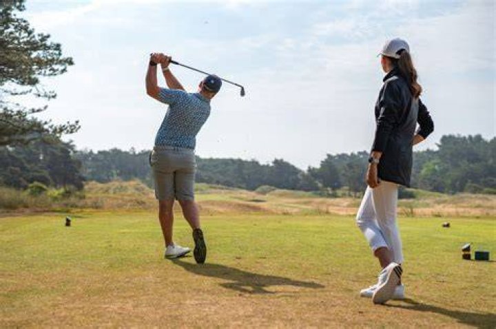 How do golfers keep warm?