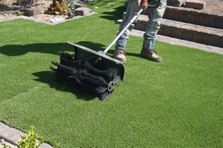 How do you brush artificial turf?