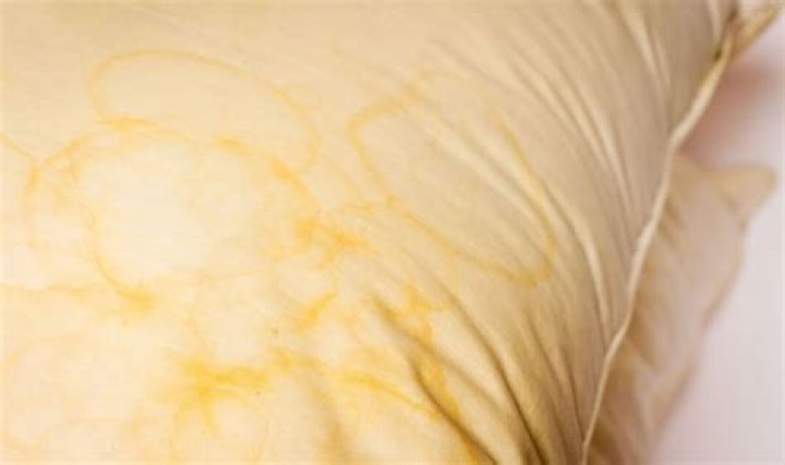 How do you get yellow sweat stains out of bedding?