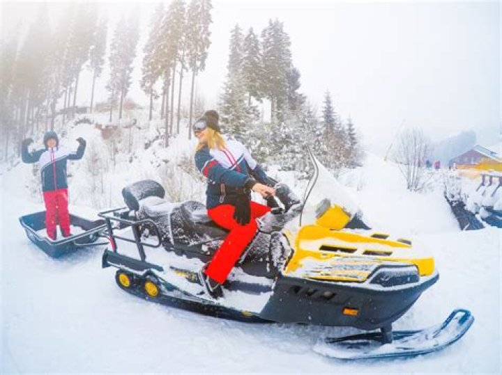How many miles can a snowmobile go on a tank of gas?