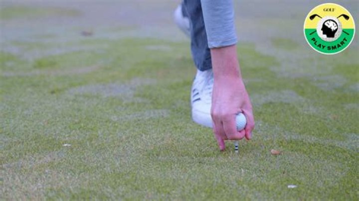 Should my hands be in front of the golf ball?