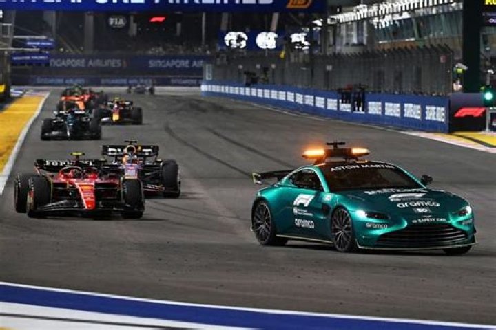 Why do race cars swerve behind safety car?