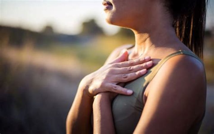 Why do runners breathe heavily after a sprint race?