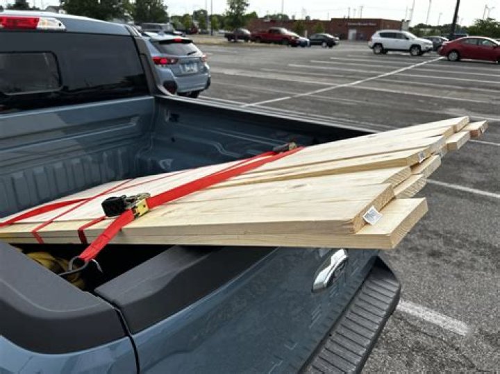 Will a snowboard fly out of truck bed?